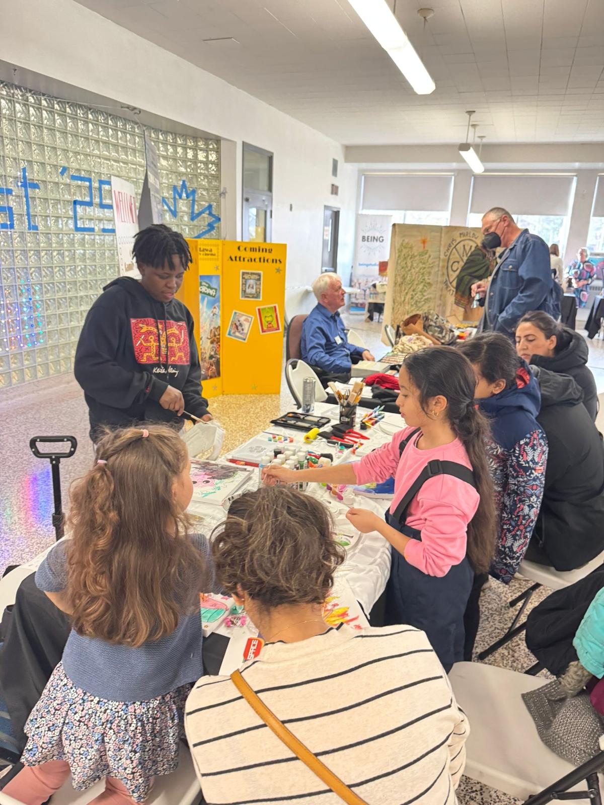 Children and families joining a painting workshop