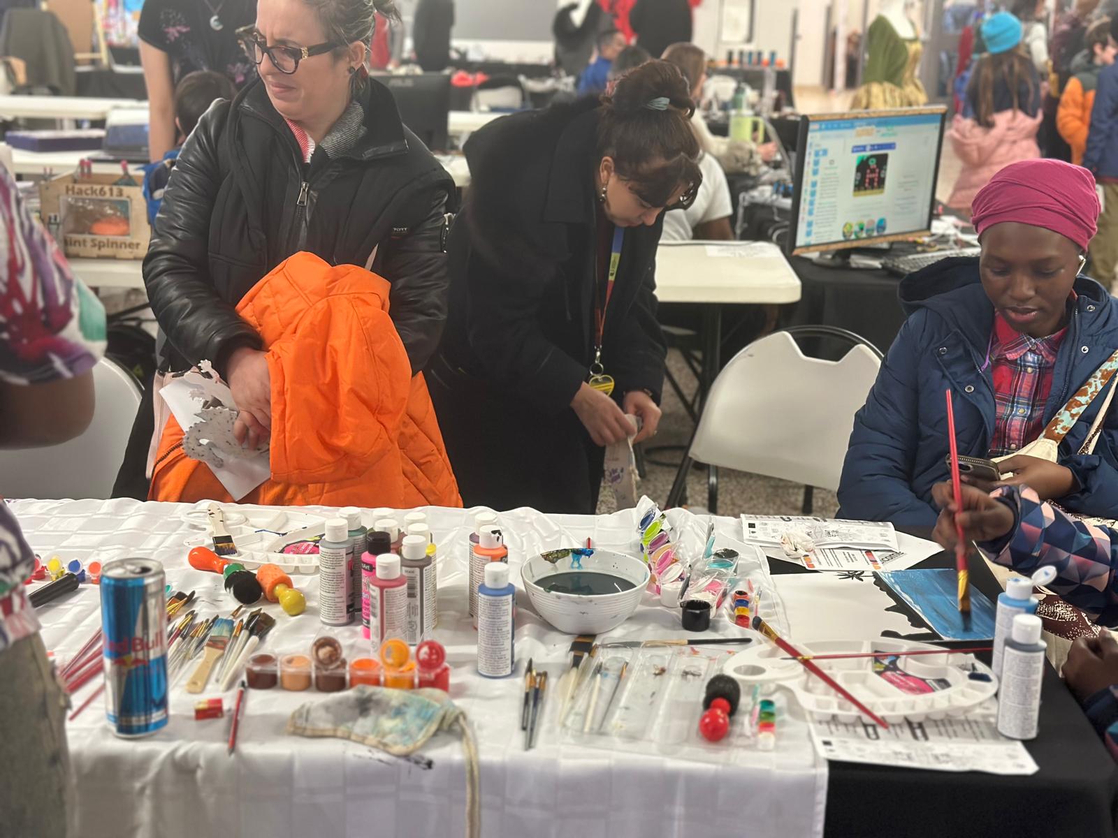 Participants painting and creating together at a community event