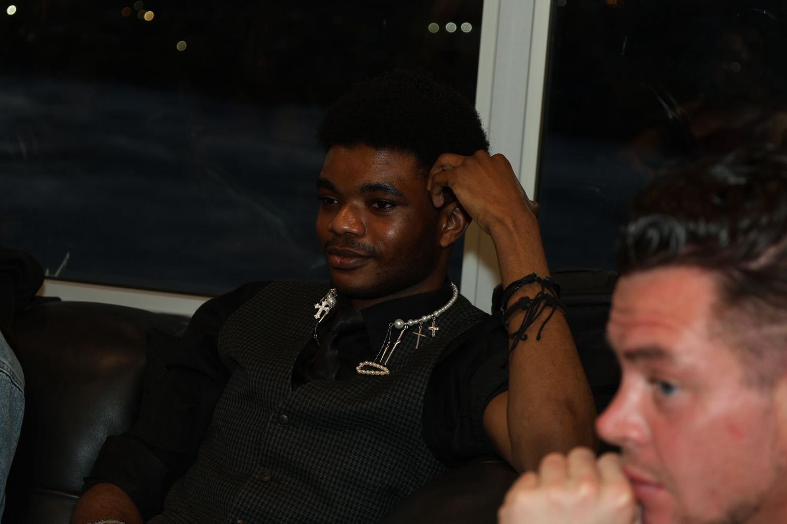 Young adult listening during a group gathering