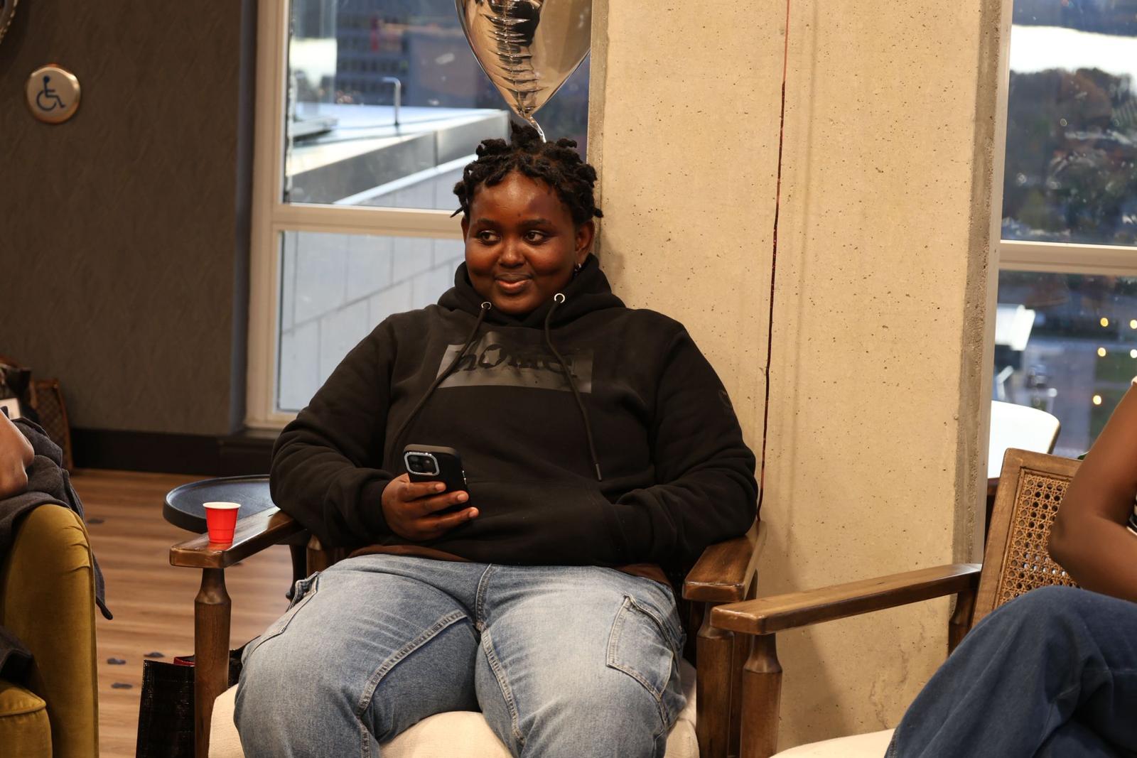Participant seated during a youth gathering