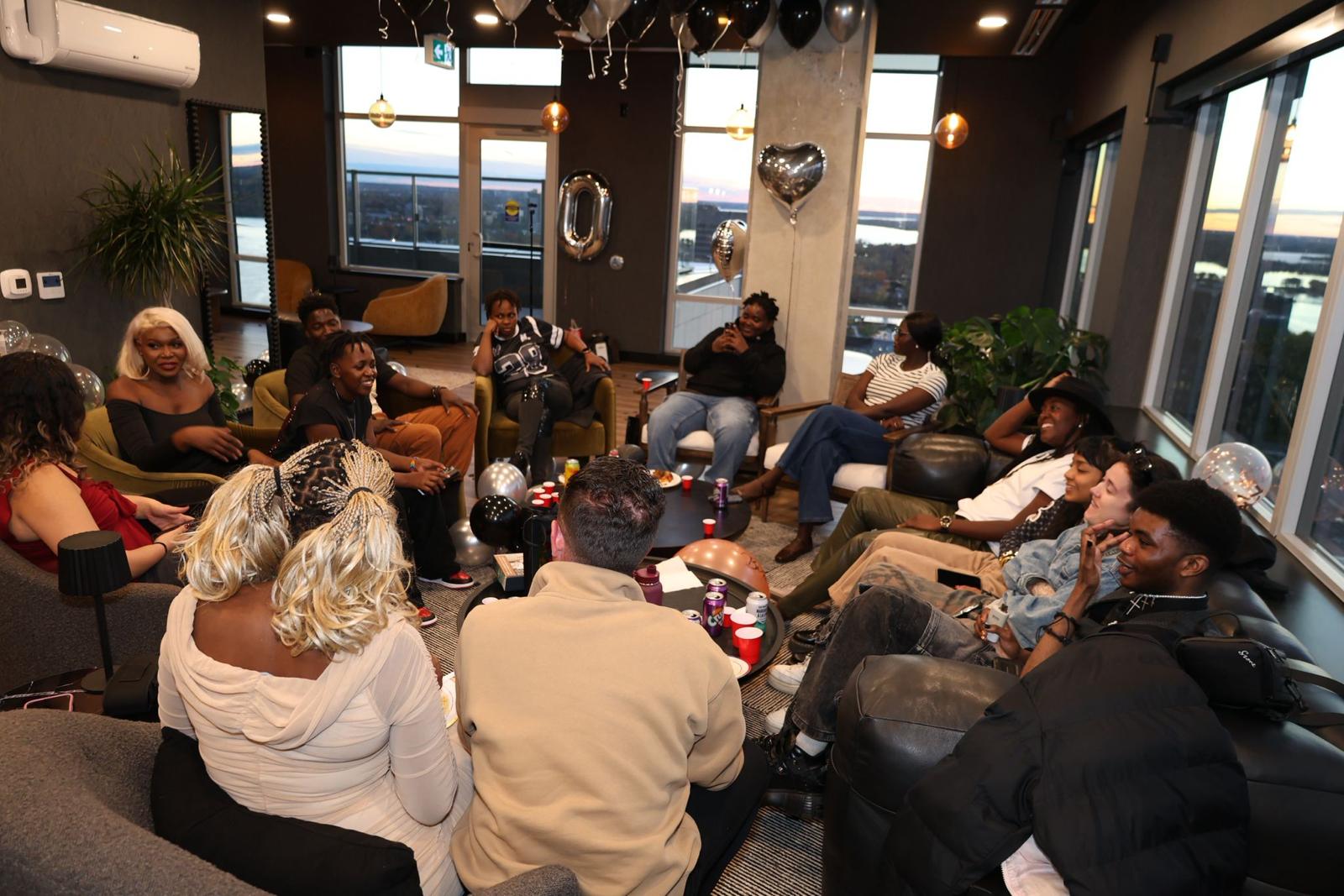 Youth and community members sitting in a discussion circle